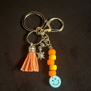 Orange and Gold Key Holder with Tassel and Smiley Charm